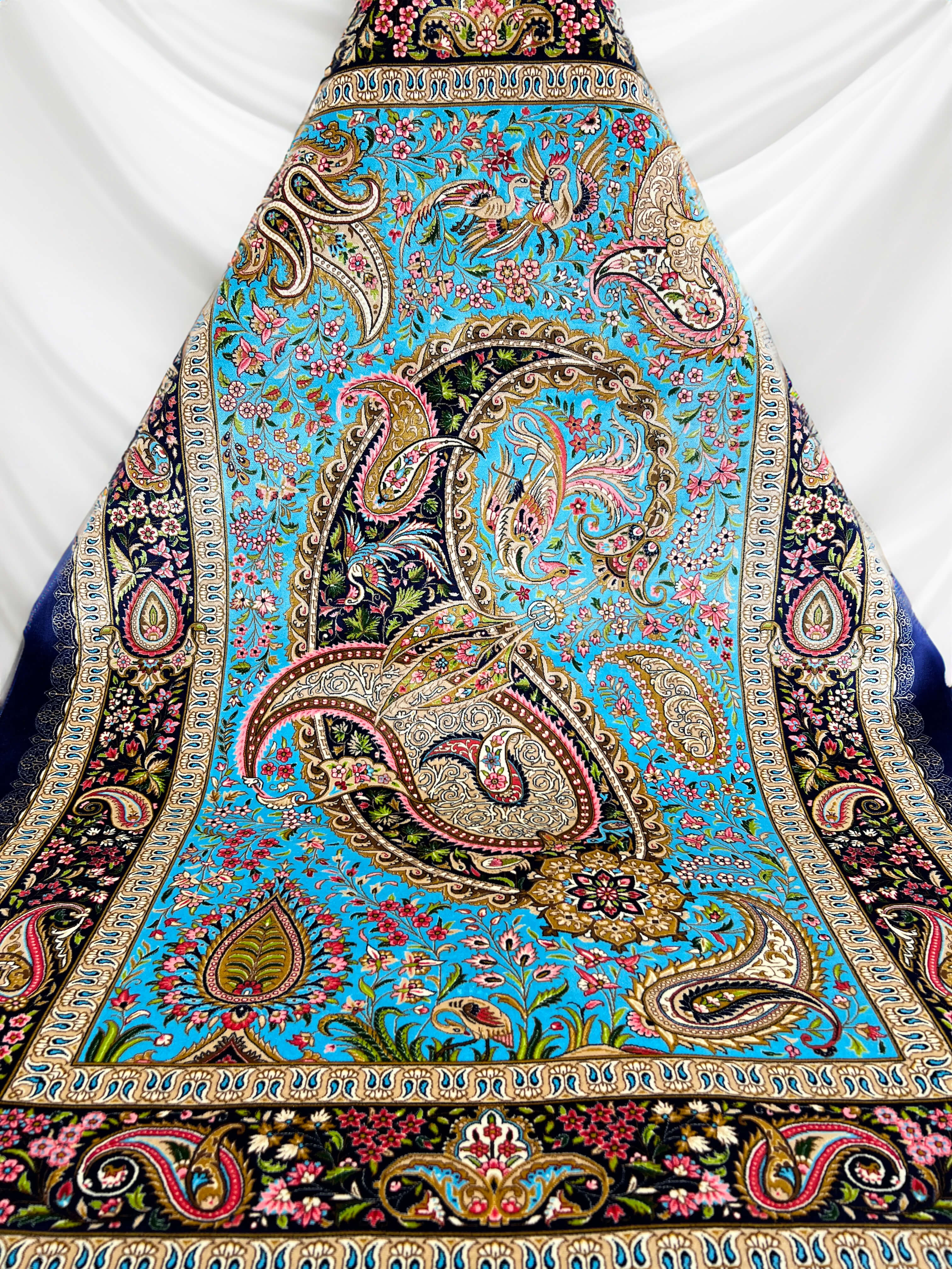 Overall view of the Blue Turquoise Paisley Boteh Silk Rug, highlighting its contrasting hues