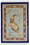 Silk Rug with a vibrant turquoise backdrop and a prominent black paisley (boteh) design